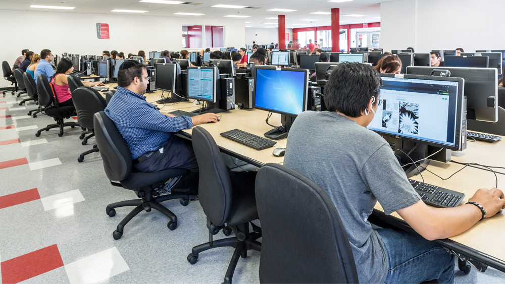 Students work at computer workstations in the USU Computer Lab