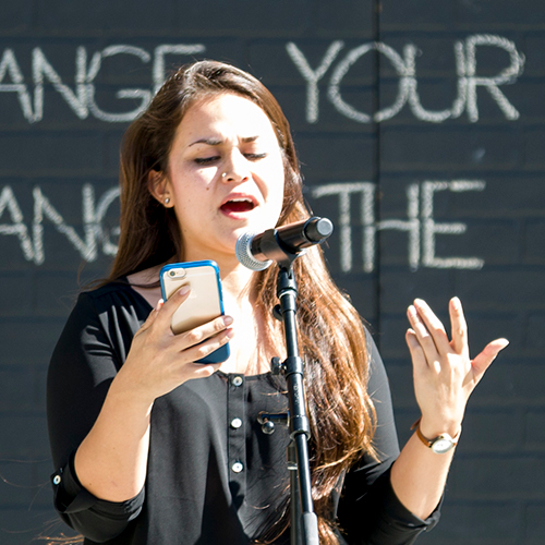 Student performs at the USU Change Your Words, Change the World event, Spring 2016