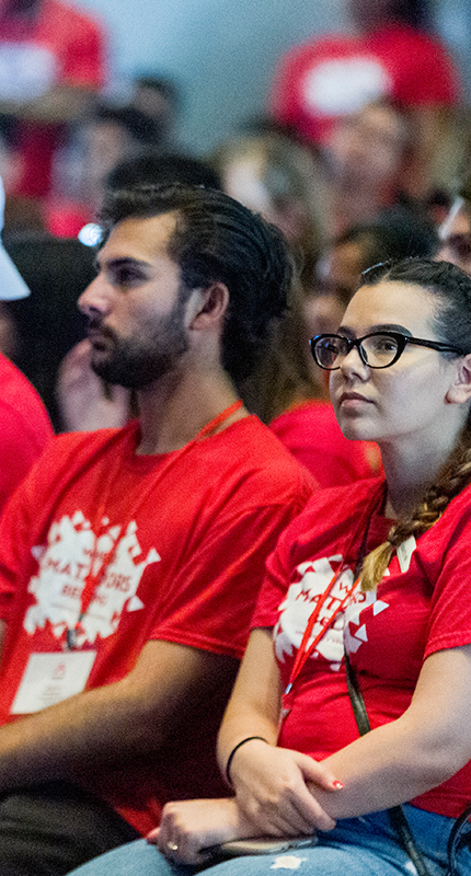 Students participating in group keynote session during Student Summit