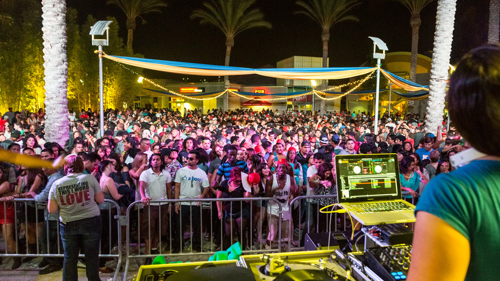 Students fill the Plaza del Sol, USU as a DJ spins in the foreground at the fall 2012 Matador Nights event