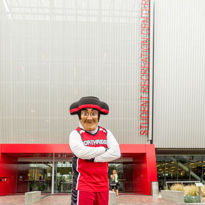 Matty the Matador standing in front of the Student Recreation Center