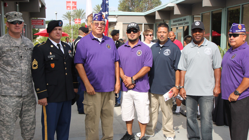 Veterans, active-duty military and community members pose at the VRC Grand Opening