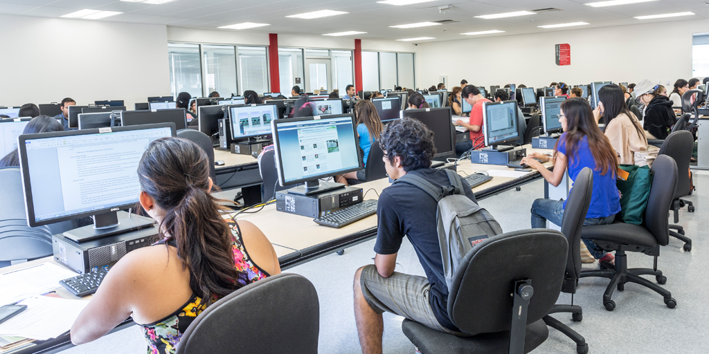 Students sitting at computer workstations in the USU Computer Lab