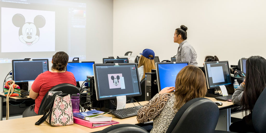 Students participaing in a computer lab workshop in the training lab